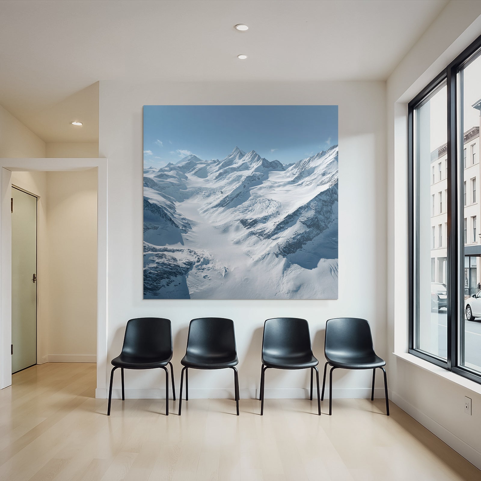 Winter landscape with snow-capped mountains and glaciers and blue sky
