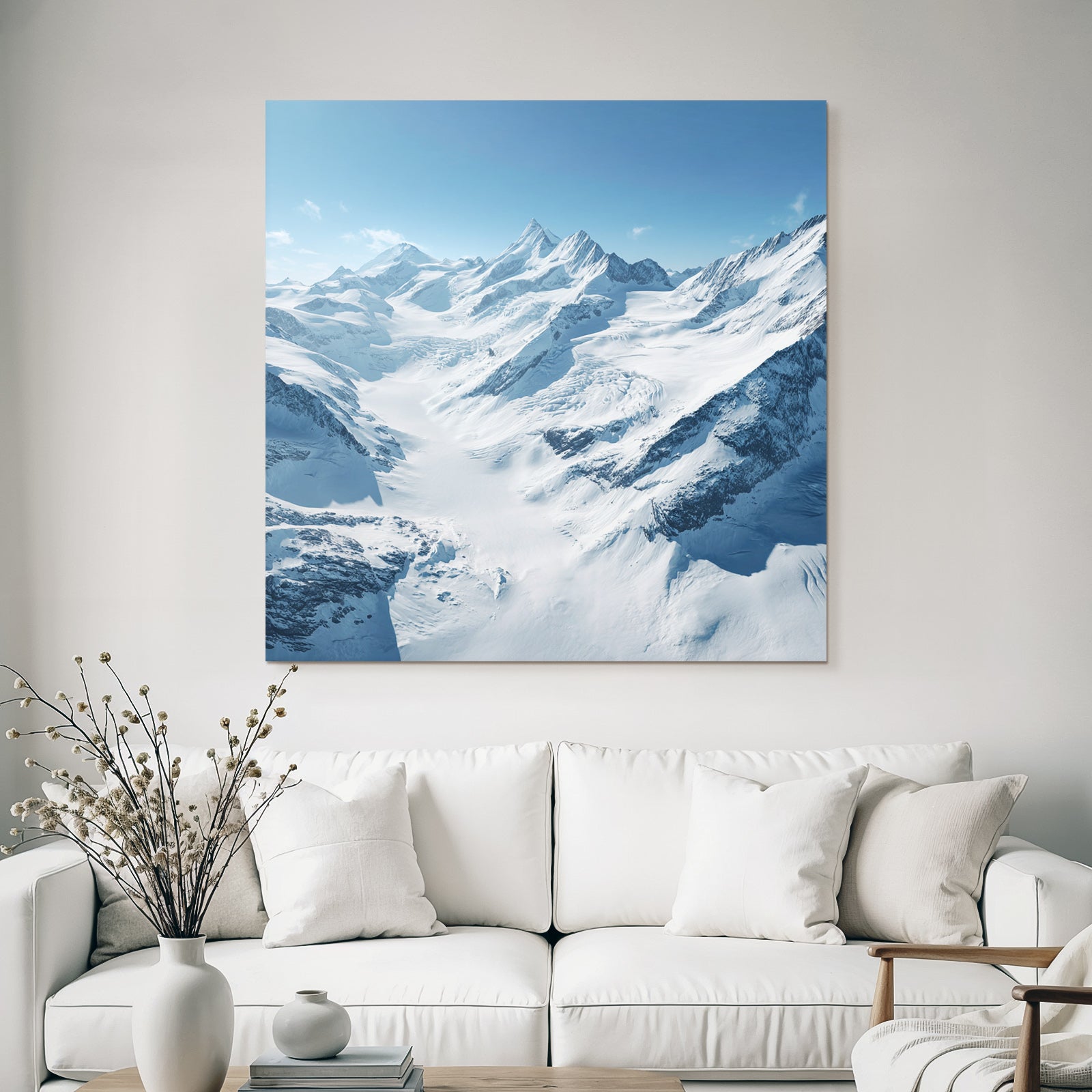 Winter landscape with snow-capped mountains and glaciers and blue sky