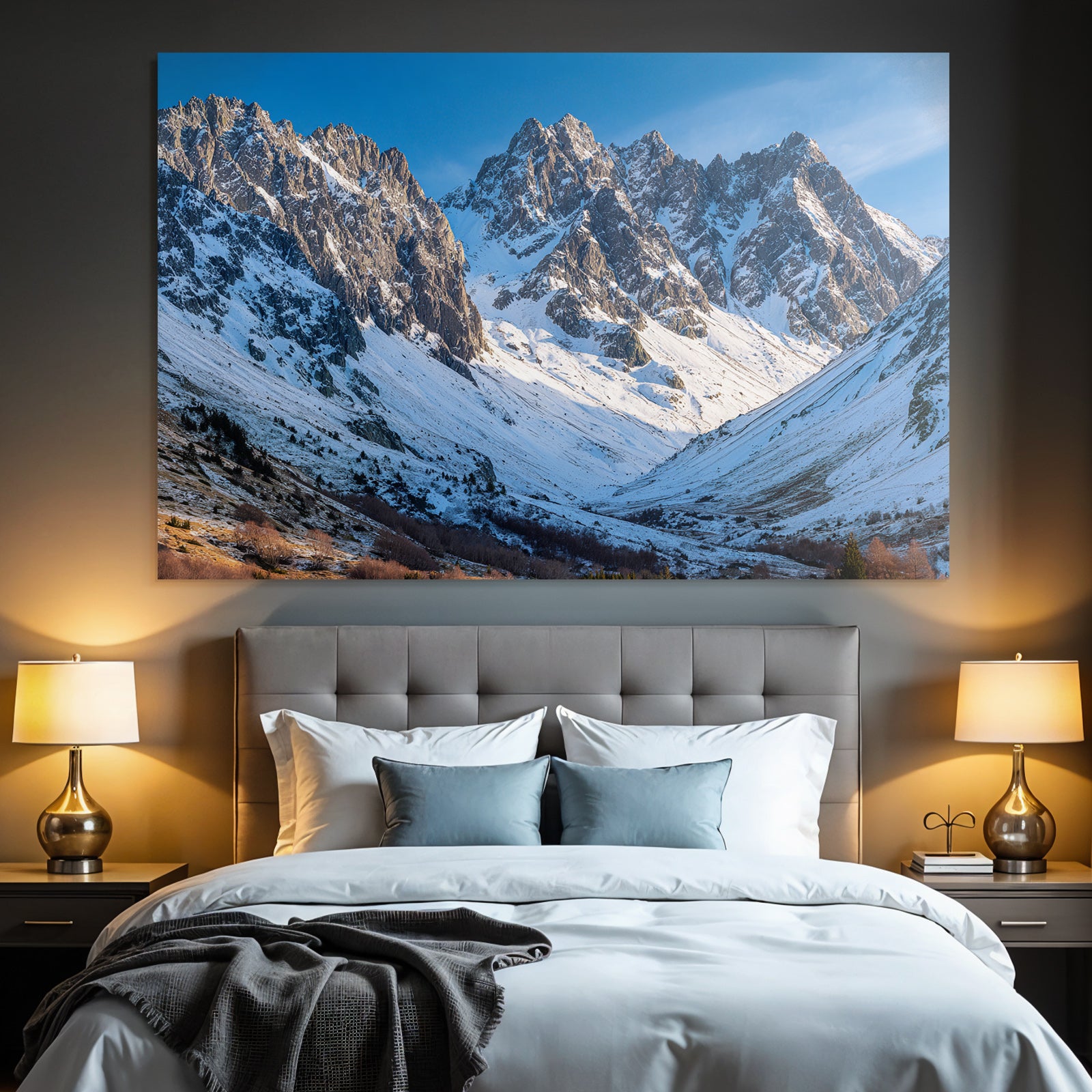 Winter mountain landscape with snow-capped peaks and blue sky