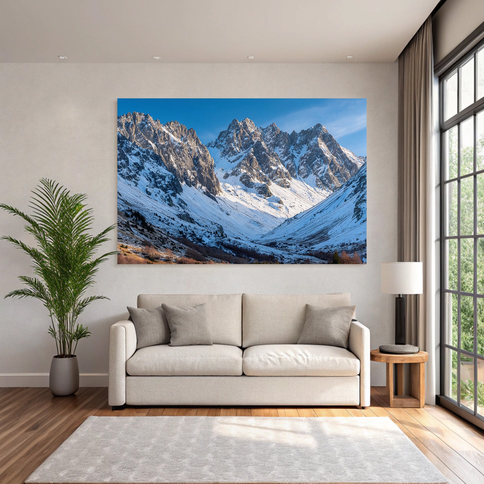 Winter mountain landscape with snow-capped peaks and blue sky