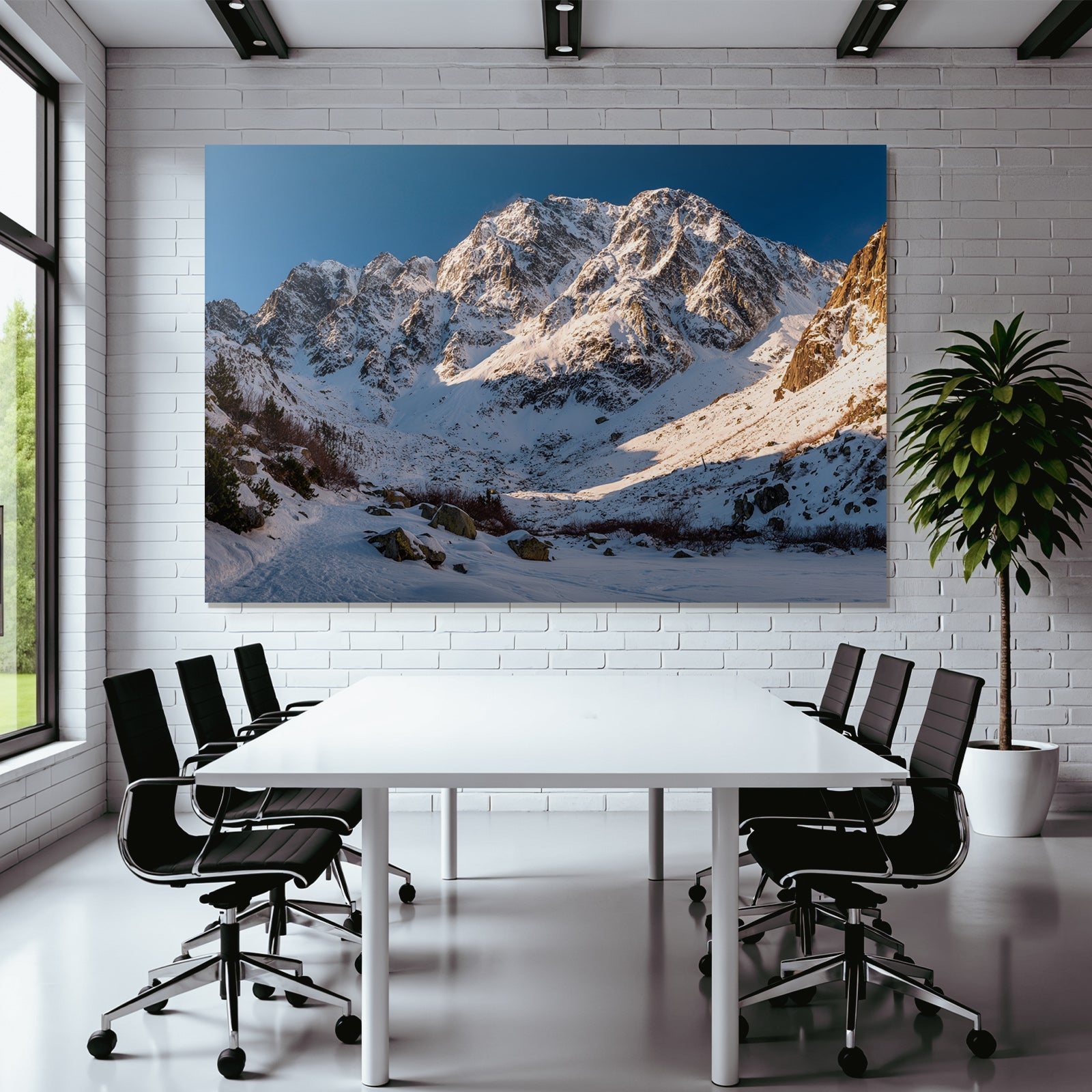 Winter snow-covered mountain landscape under a clear blue sky