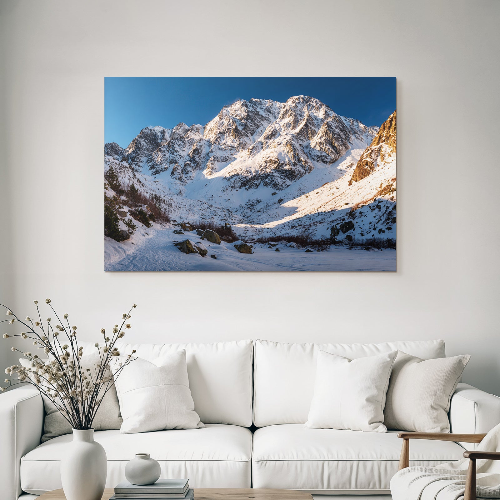 Winter snow-covered mountain landscape under a clear blue sky