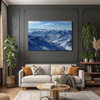 Winter snow-covered mountains under blue sky with clouds