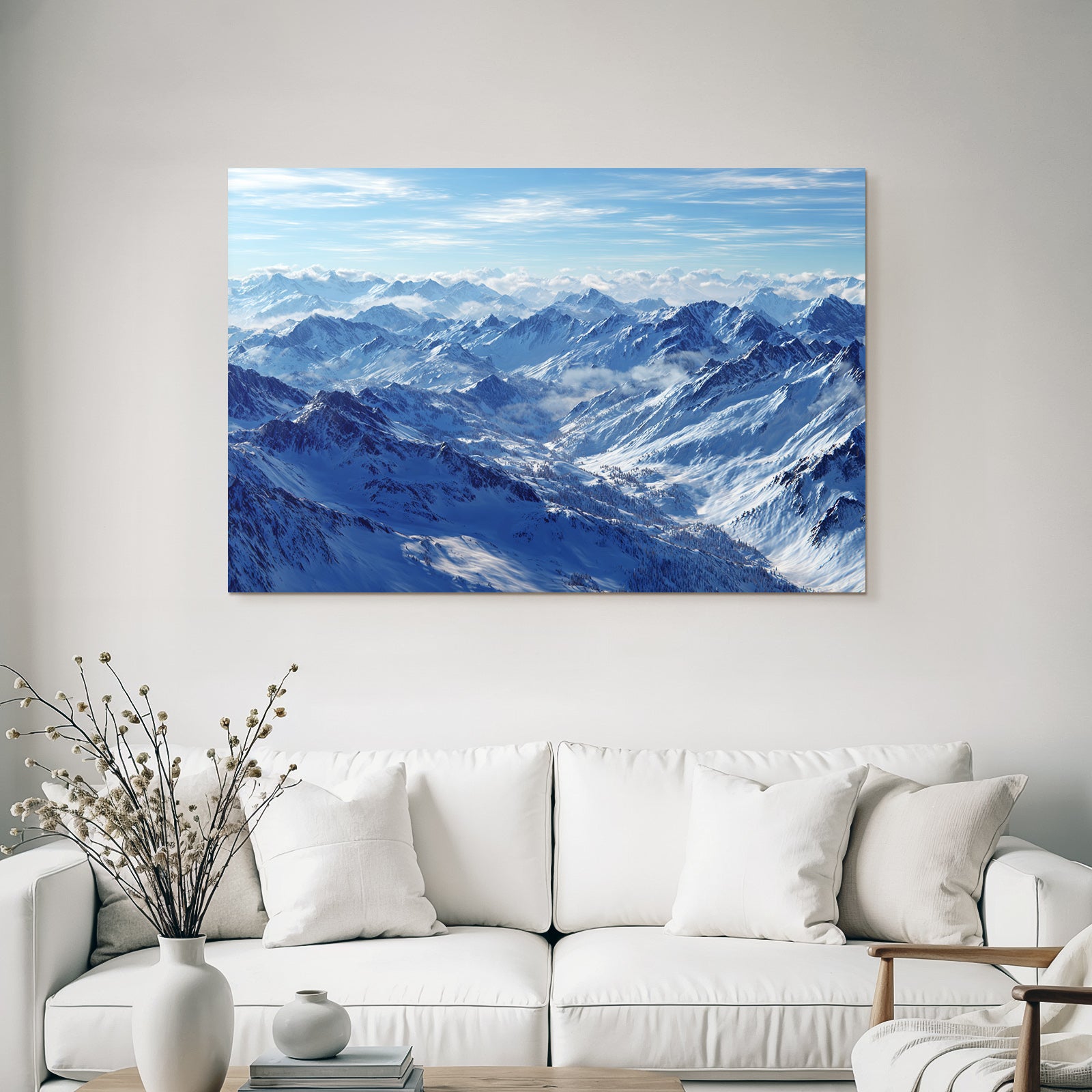 Winter snow-covered mountains under blue sky with clouds