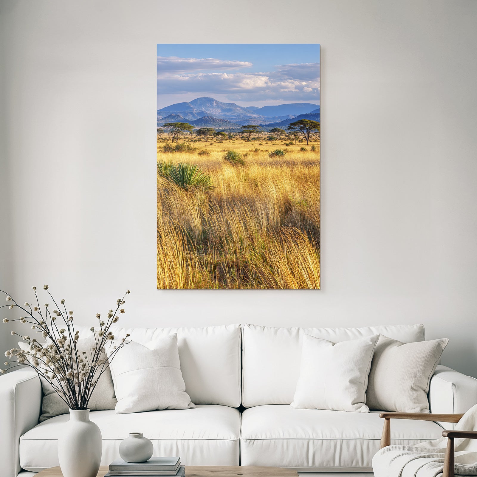 Desert golden grassland with acacia trees and mountains under cloudy sky