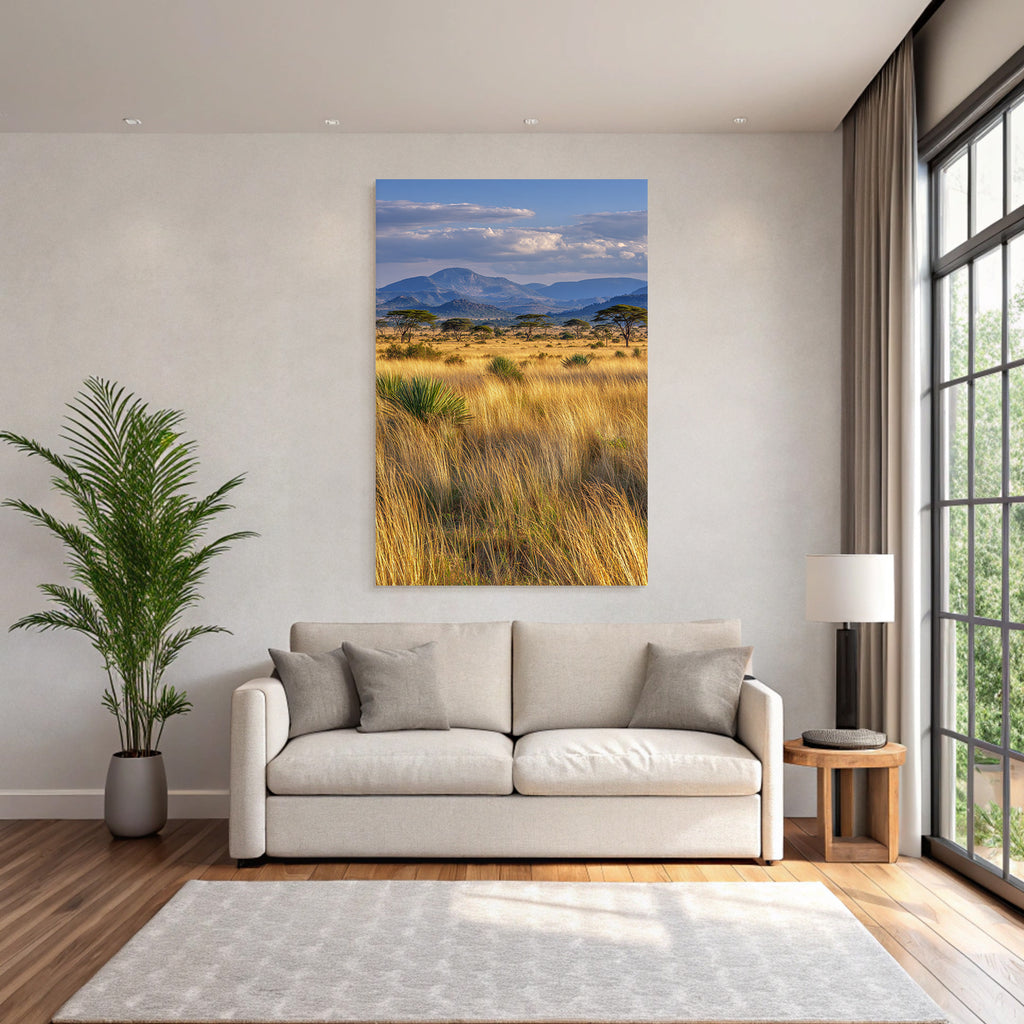 Desert golden grassland with acacia trees and mountains under cloudy sky