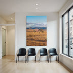 Desert golden grass landscape with trees and hills under blue sky