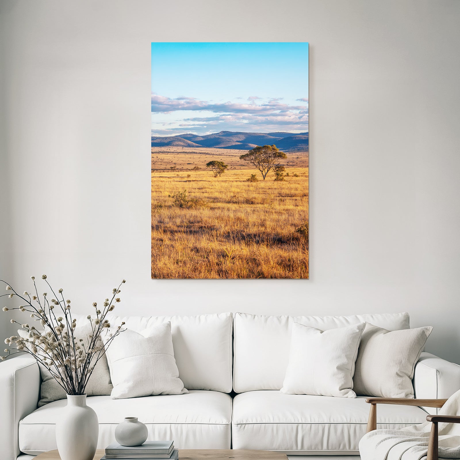 Desert golden grass landscape with trees and hills under blue sky