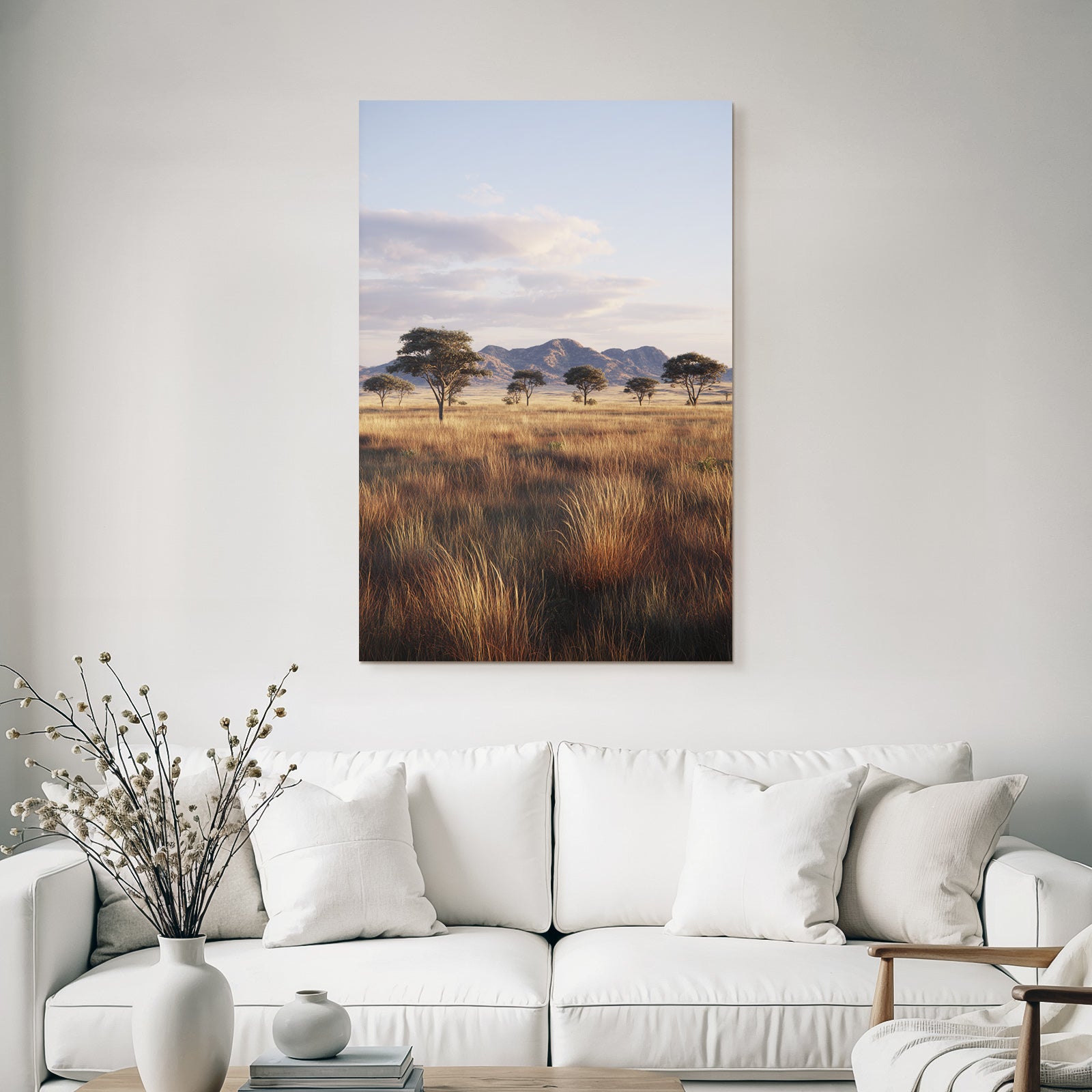 Desert tranquil landscape with grass, trees and mountains in the background