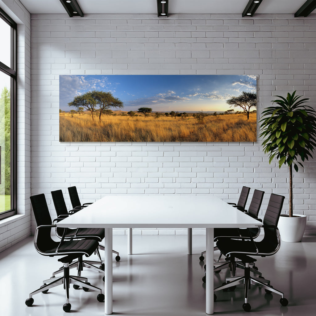 Desert panoramic view of savannah with golden grasslands and blue skies