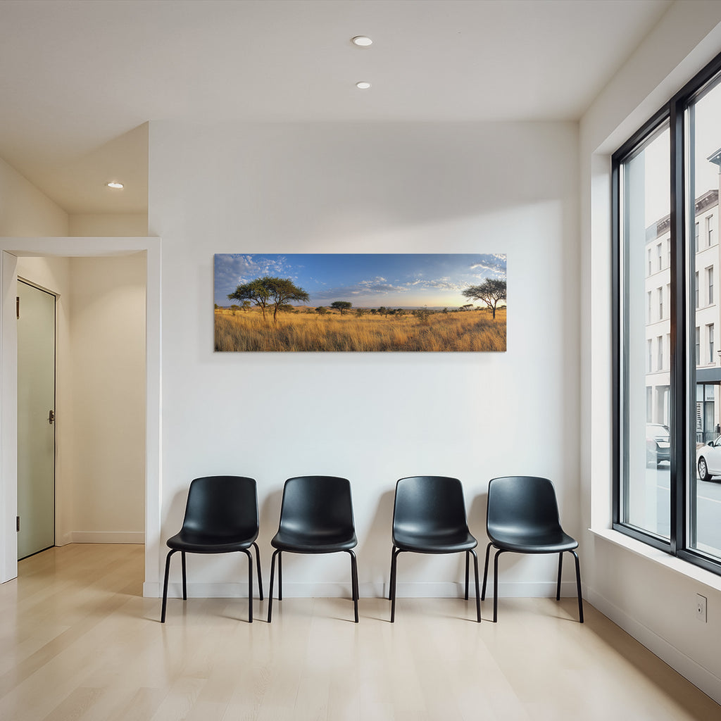 Desert panoramic view of savannah with golden grasslands and blue skies