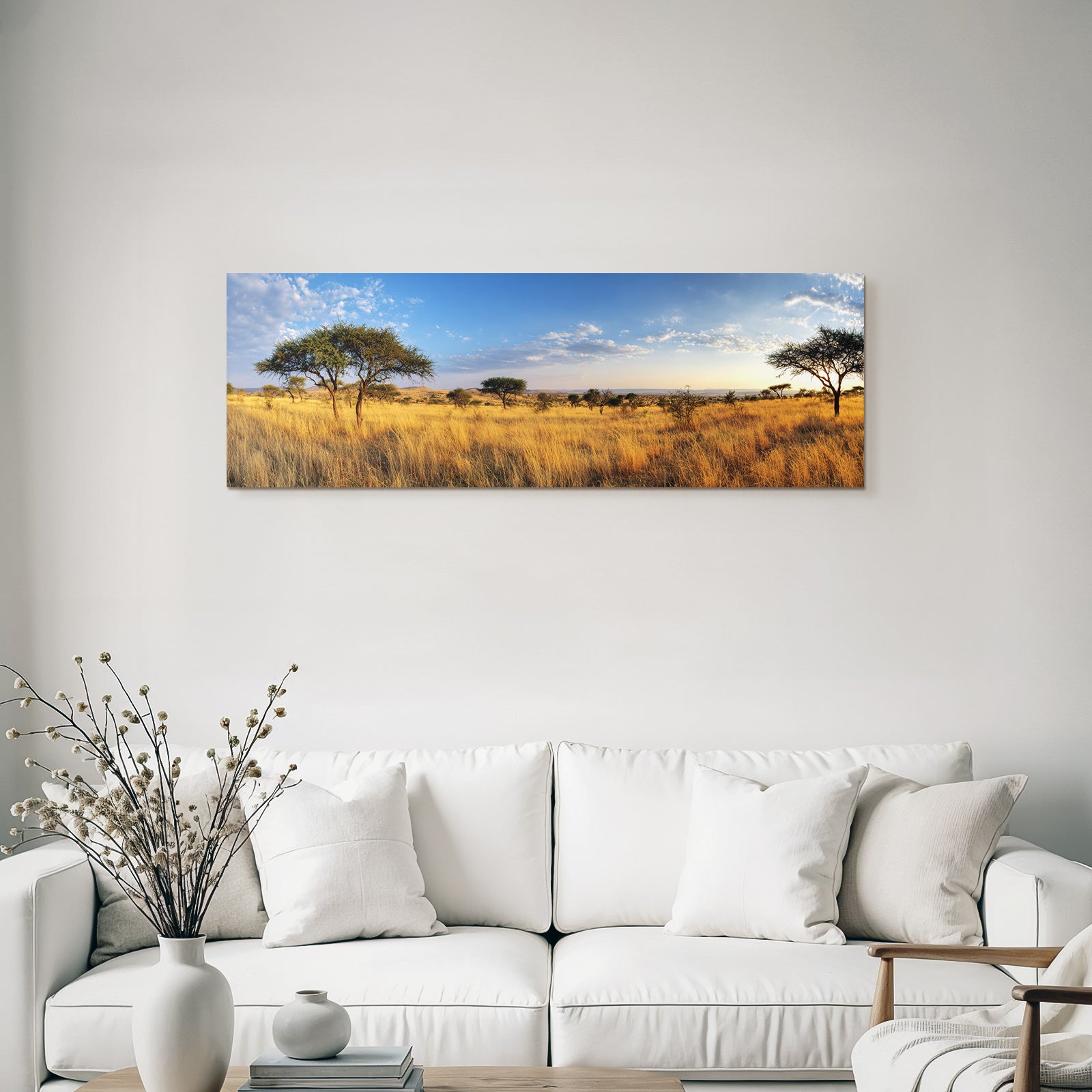 Desert panoramic view of savannah with golden grasslands and blue skies