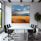 Desert tranquil natural landscape with hills and golden grass under partly cloudy sky