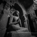 Carved Stone Statü Seated Figure Prayer Position Buddhist Art Cave Temple Setting | Spirituelle Motive und Buddha | Menschen und Emotionen