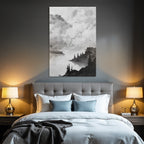 Monochrome landscape painting of a waterfront with trees and rocks under a cloudy sky