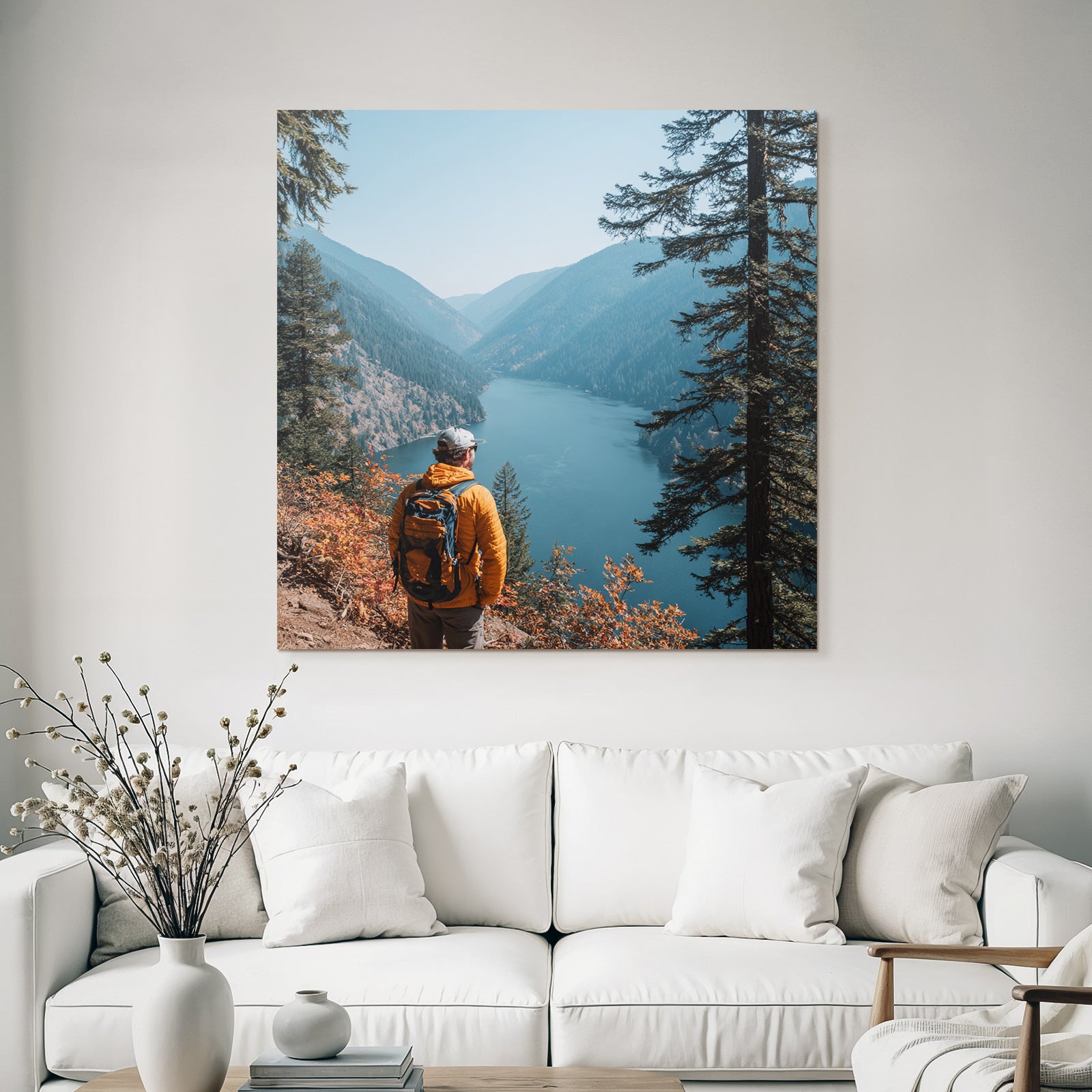 Scenic Mountain Landscape With Person In Orange Jacket At Lake