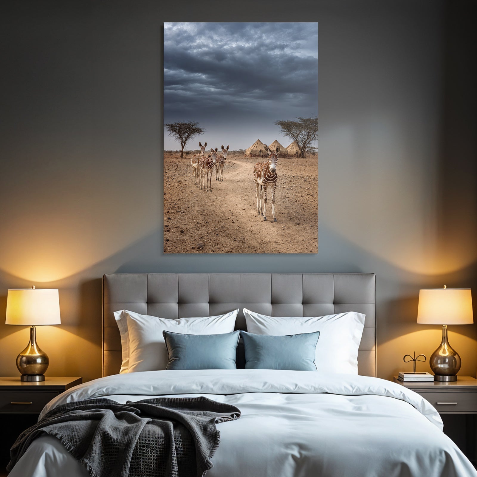 Zebras on the dusty path with tent camp and dramatic sky