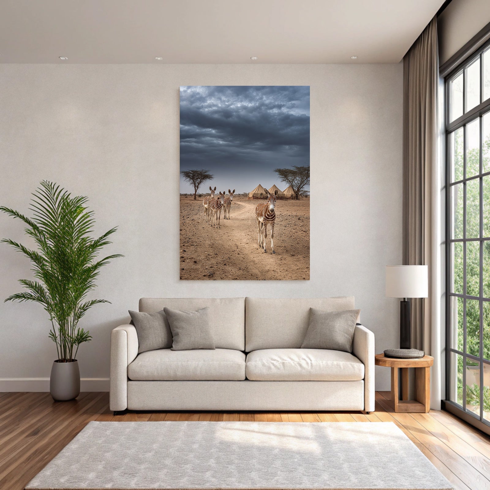 Zebras on the dusty path with tent camp and dramatic sky